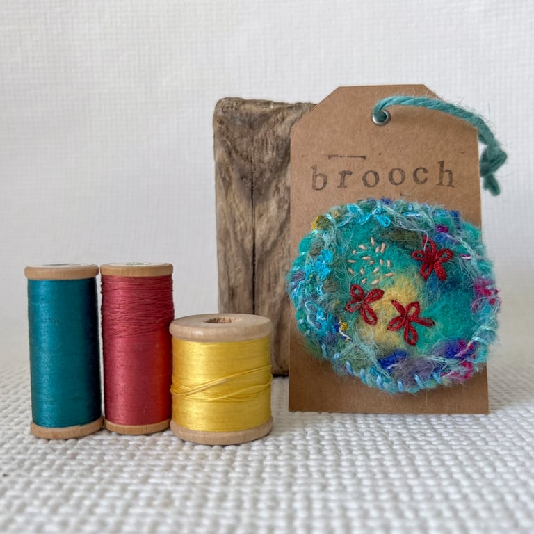 Needle felted hand embroidered circular brooch 