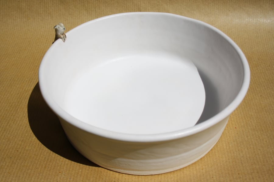 Handmade white ceramic dog bowl with little dog figure 