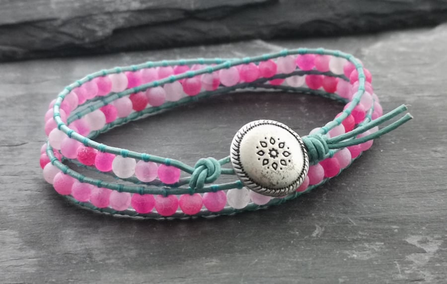 Pink agate and light teal leather bracelet with silver button with flower motif