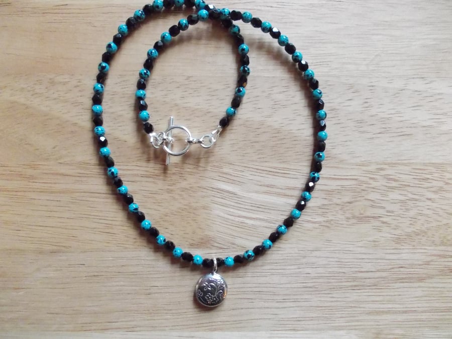 Gemstone necklace with locket pendant