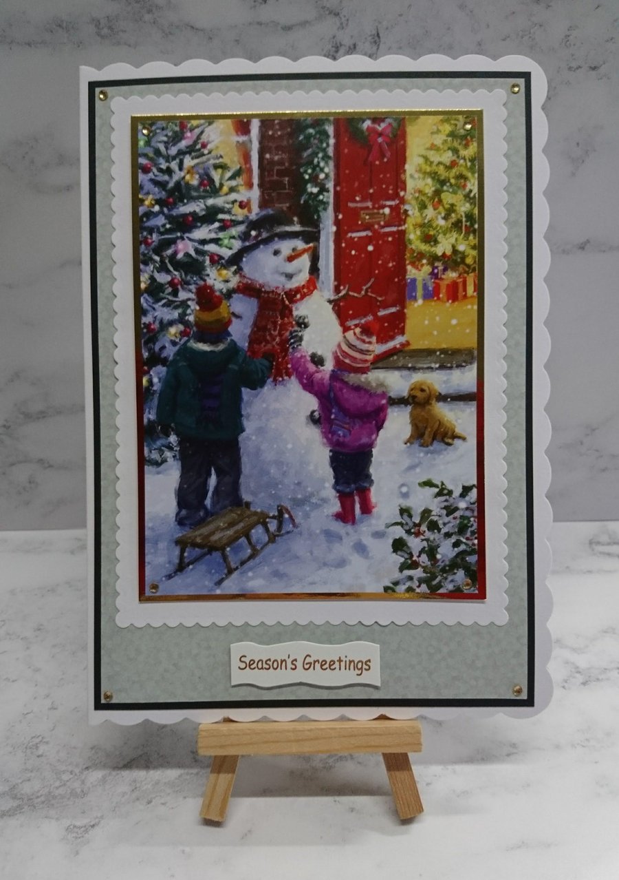 Handmade Christmas Card Children with Dog Decorating a Snowman