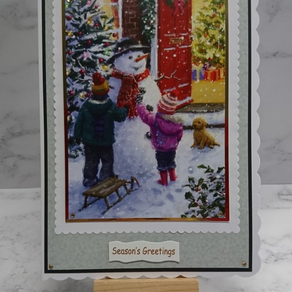 Handmade Christmas Card Children with Dog Decorating a Snowman