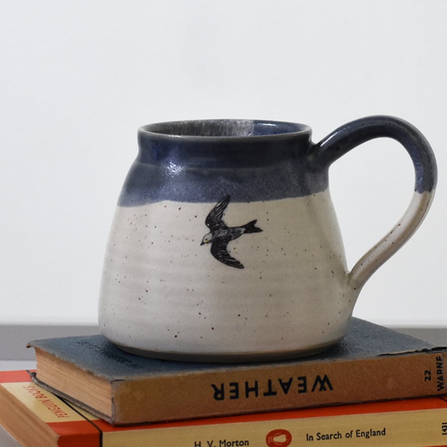 Ceramic mug with flying bird - blue and white handmade pottery