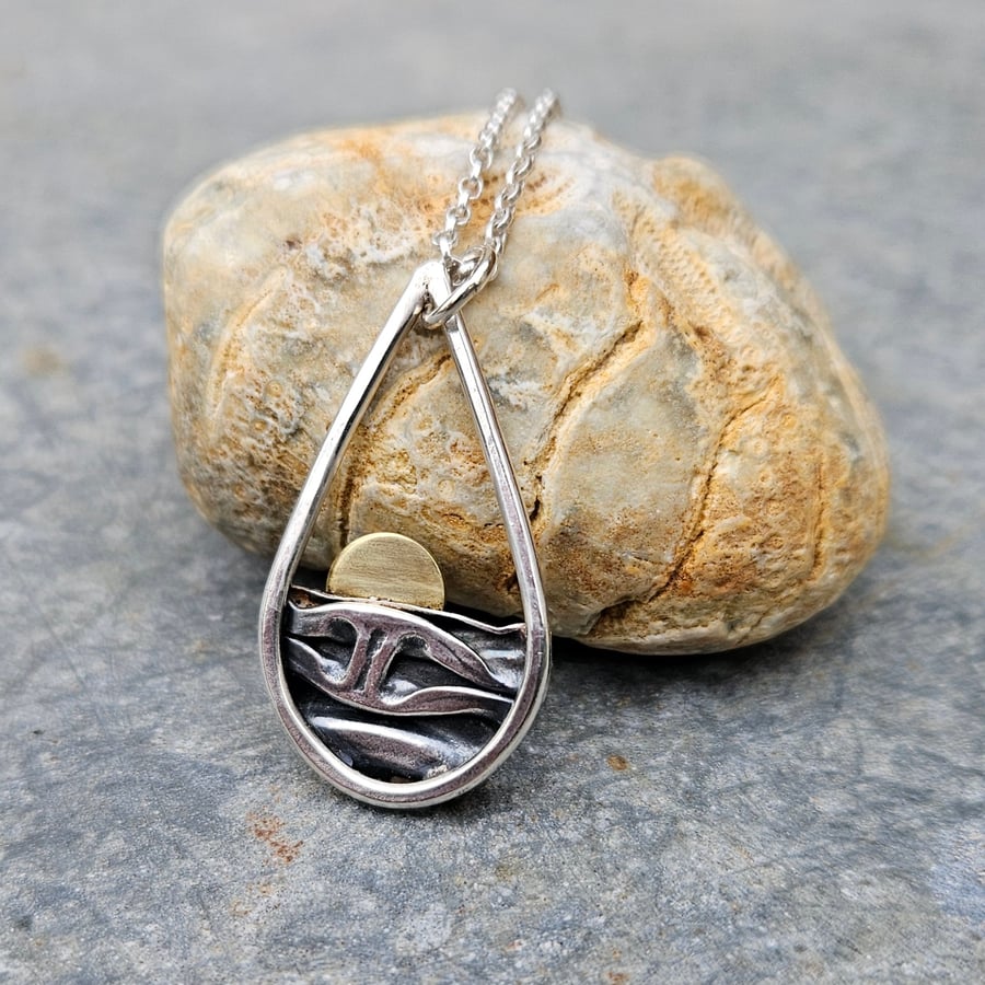 Silver teardrop sun rising over the sea pendant