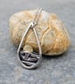 Silver teardrop sun rising over the sea pendant