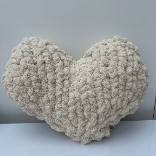 Hand knitted heart cushion