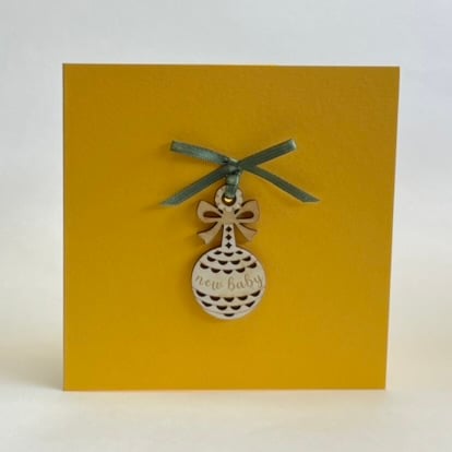 'New baby' rattle card with detachable decoration