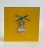 'New baby' rattle card with detachable decoration