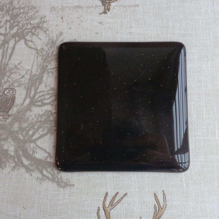 Fused glass coaster in deep dark amber-brown-black