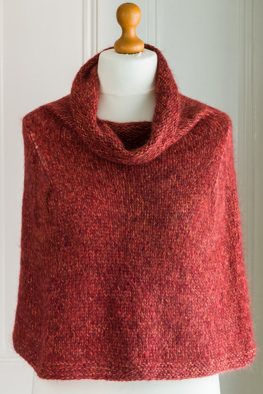 This cape is a super soft and warm capelet or poncho, hand knit and seamless