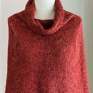 This cape is a super soft and warm capelet or poncho, hand knit and seamless