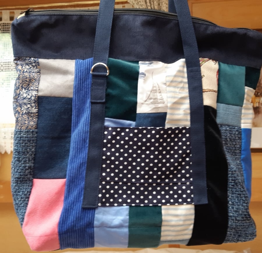Navy and patchwork holdall