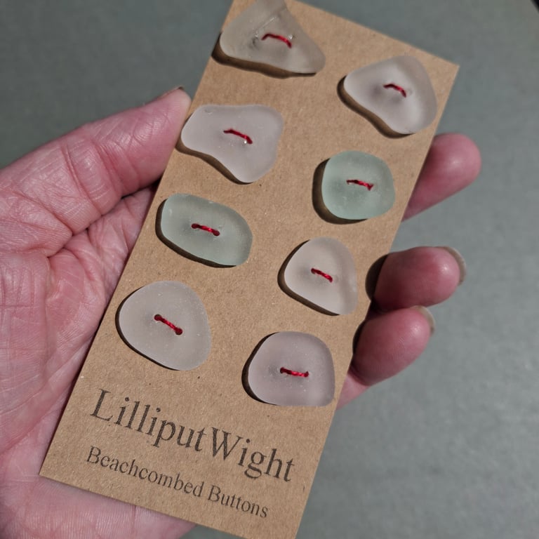 Set of eight white and sea foam sea glass buttons