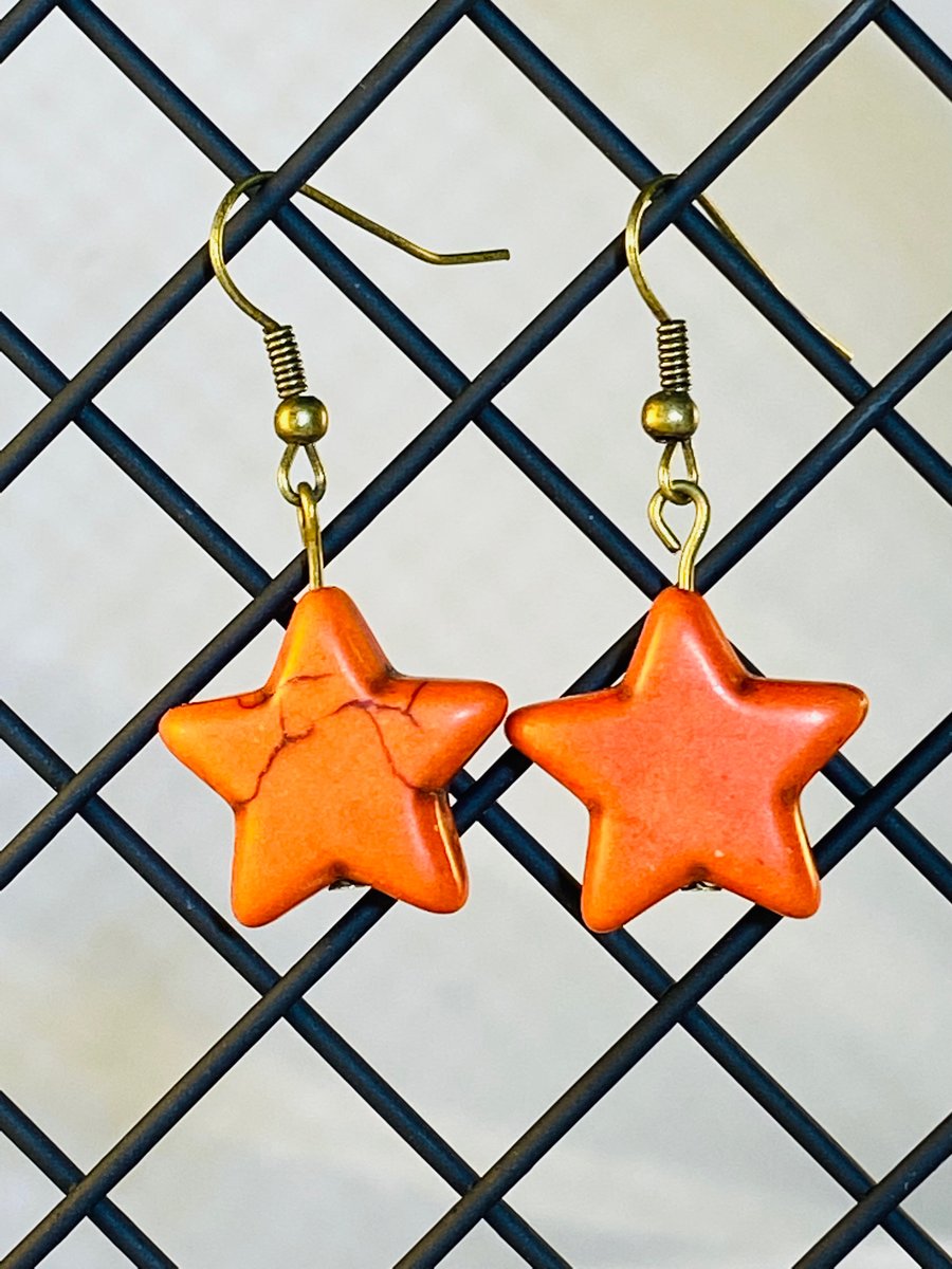 Orange star earrings
