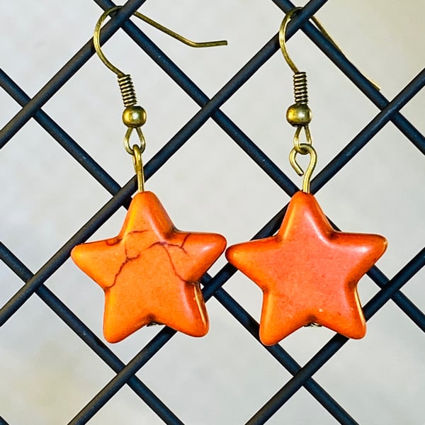 Orange star earrings