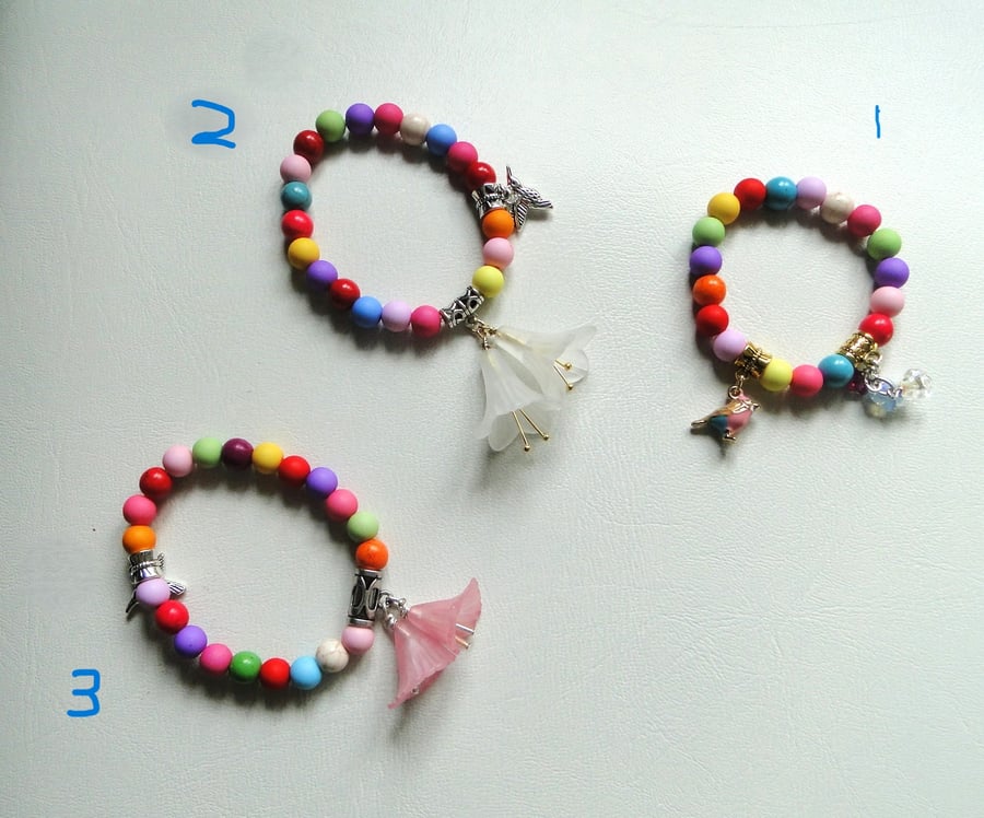 Tropical themed bracelets  Bright coloured beads - flower bird butterfly charms 