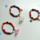 Tropical themed bracelets  Bright coloured beads - flower bird butterfly charms 