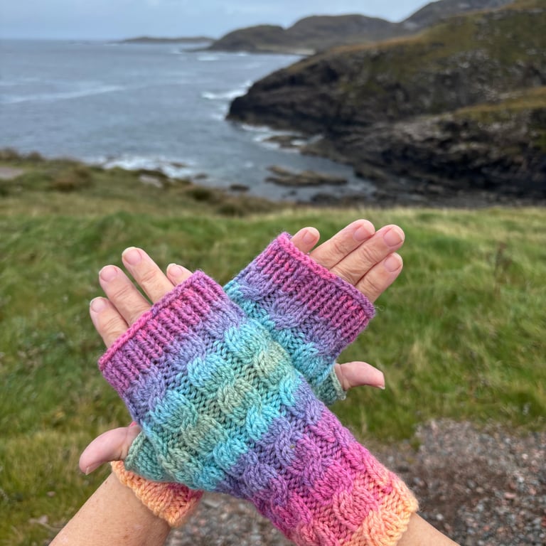 Hand knitted fingerless gloves in vibrant colours 