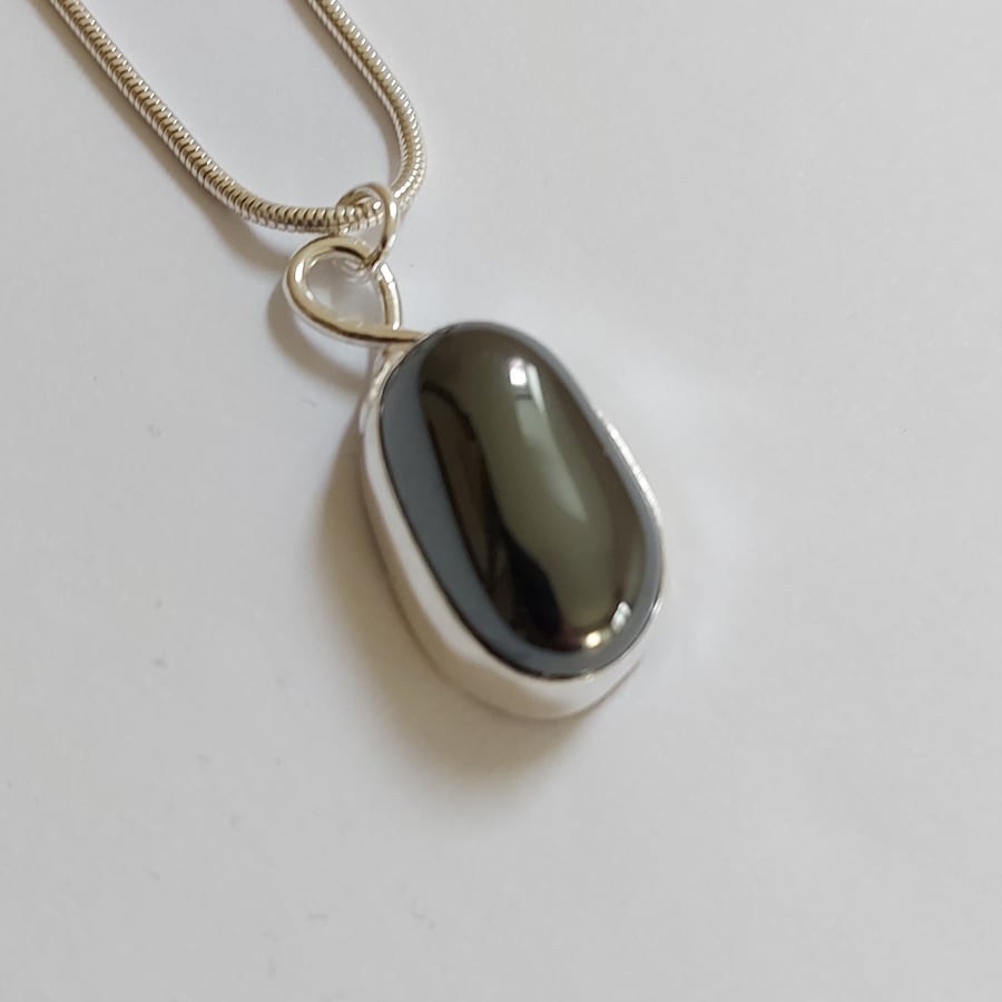 Sterling silver pendant with freeform gemstone: glossy dark grey Haematite