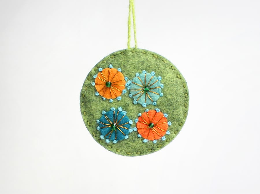 Circular felt hanging decoration with hand embroidery