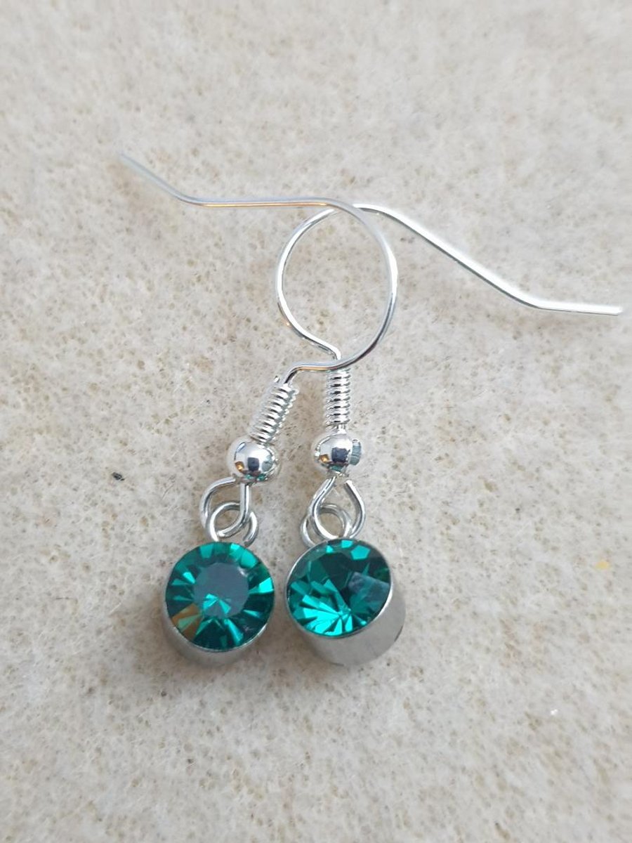 sweet little silver plated earrings with mini sea green teal glass pendants