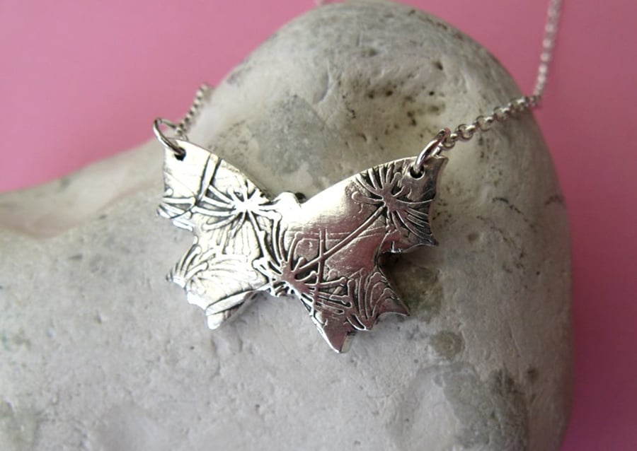Fine silver butterfly necklace with dandelion clock pattern