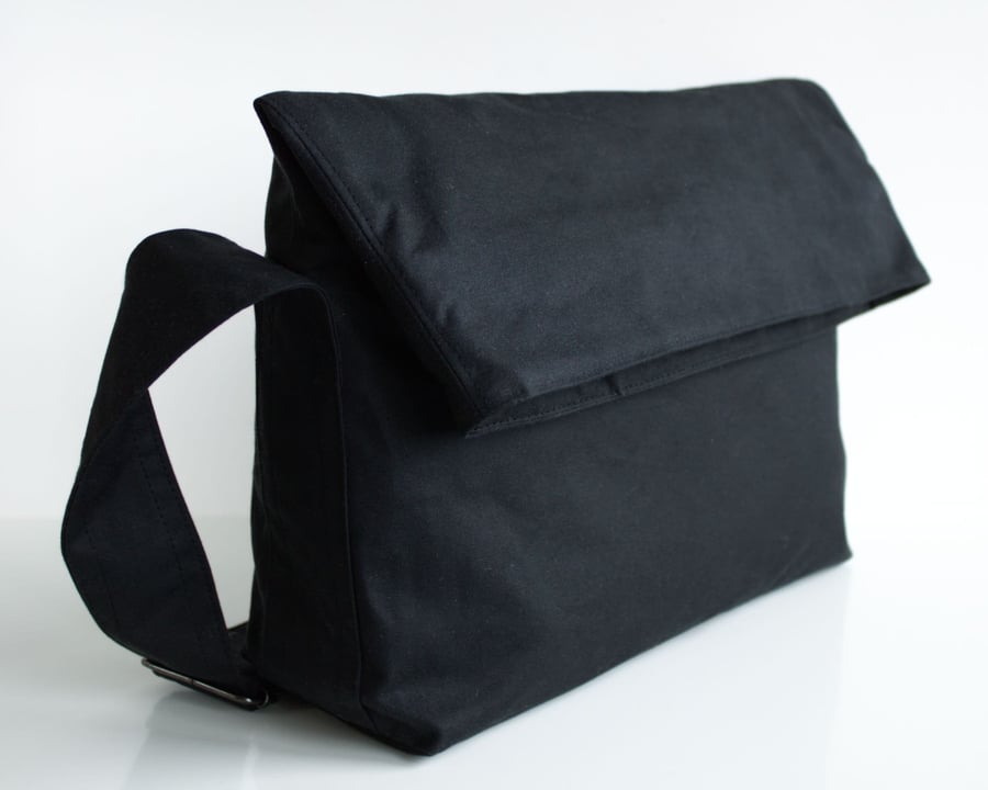 Minimal fold top bag in black waxed canvas by Minus