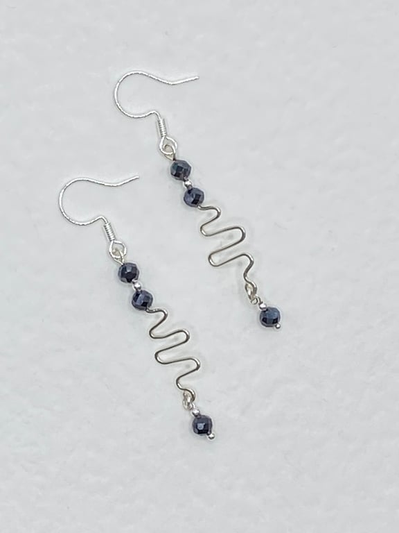 Squiggle drop earrings with faceted spinel stones 