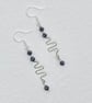 Squiggle drop earrings with faceted spinel stones 