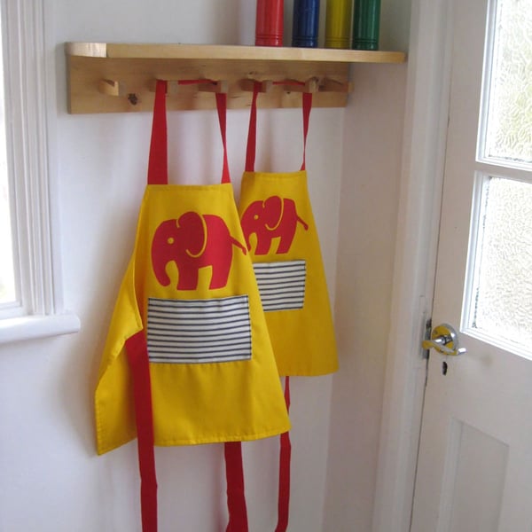 Age 1-2 yrs. Red 'Efalant' hand appliquéd child's yellow apron