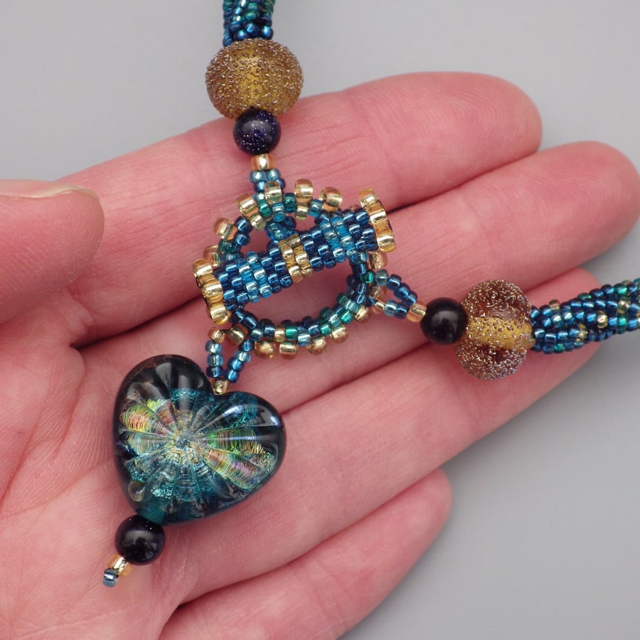 Blue and gold beadwoven necklace with UK lampwork starburst heart bead