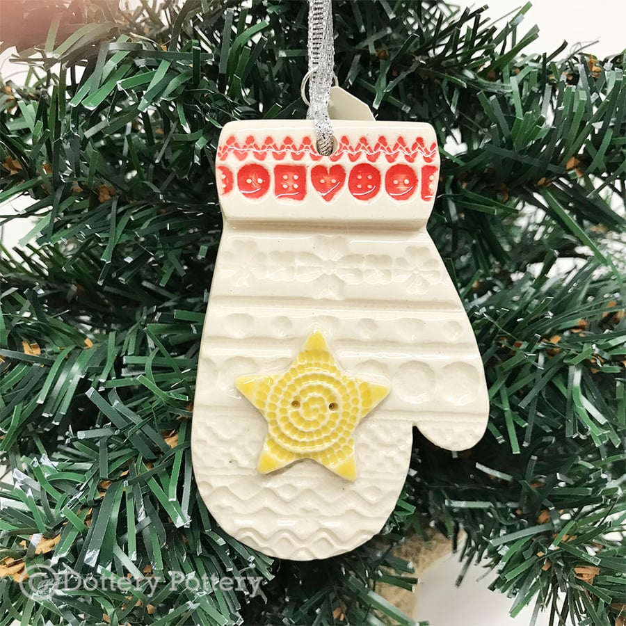 Ceramic Christmas mitten with a yellow star