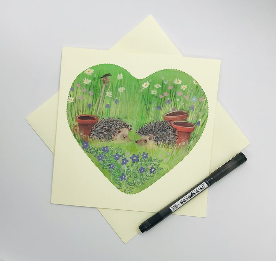 Hedgehogs in a wildflower garden, greetings card