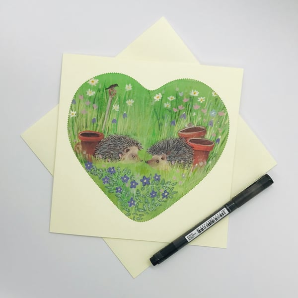 Hedgehogs in a wildflower garden, greetings card