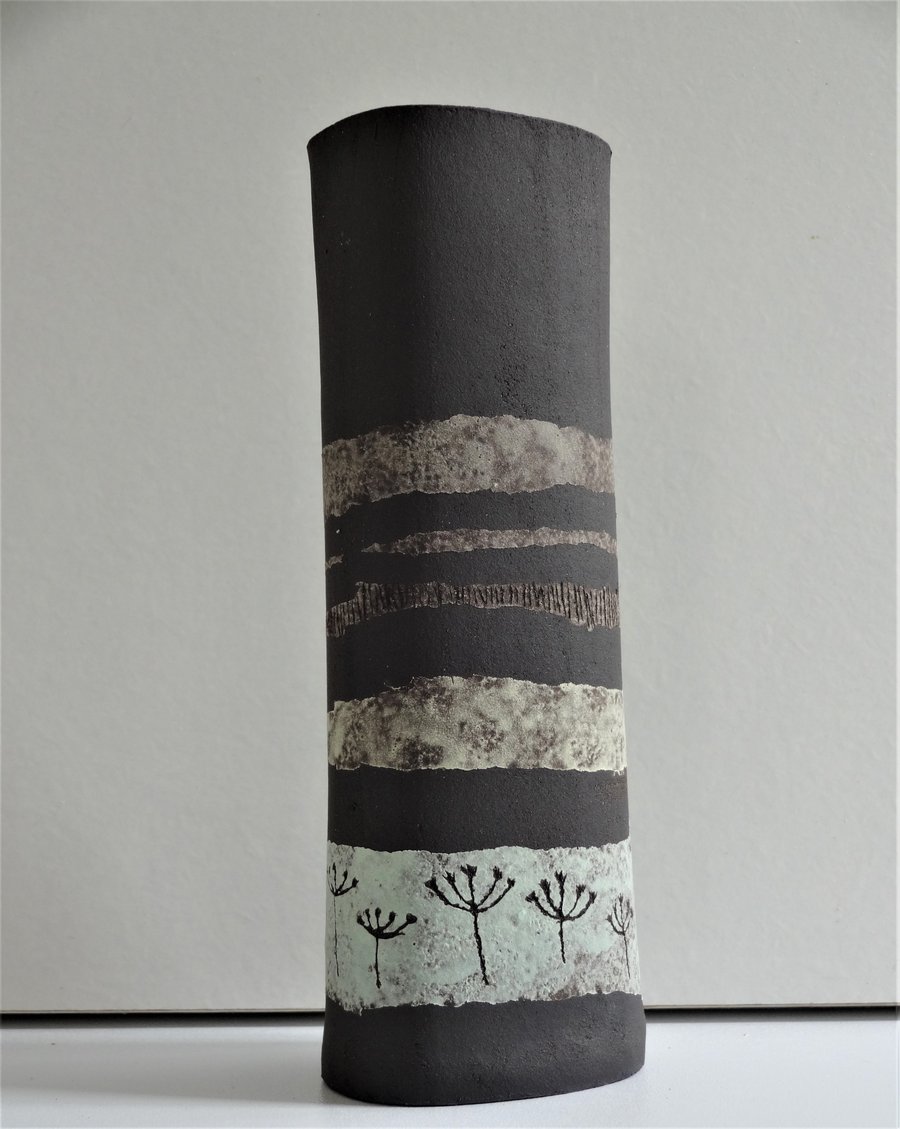 Fiona.  Matt black stoneware ceramic vase with pastel colour bands and motifs.