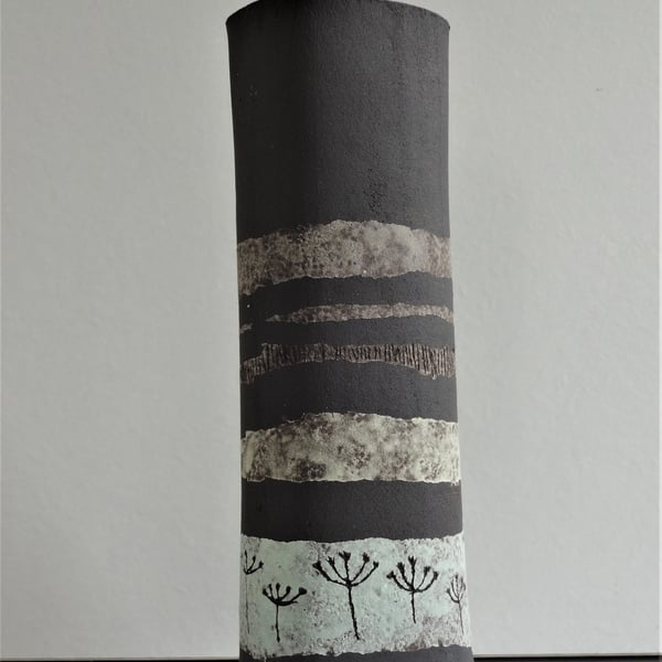 Fiona.  Matt black stoneware ceramic vase with pastel colour bands and motifs.