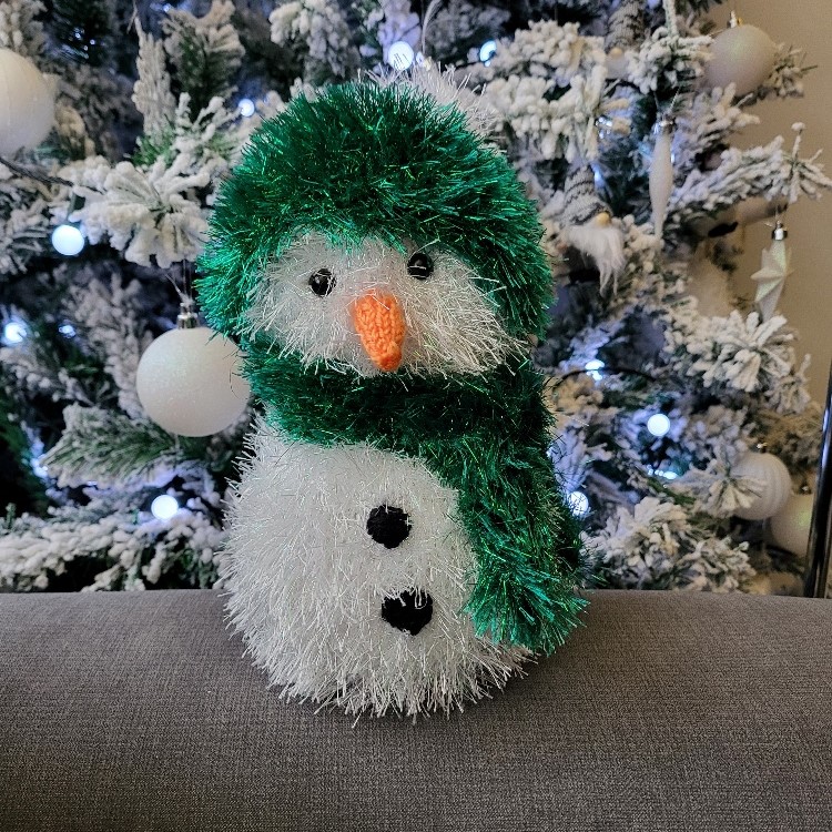 Snowman with green & white hat and scarf hand knitted and perfect for Christmas