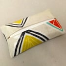 Tissue holder in beige oilcloth with yellow leaves, tissues included.