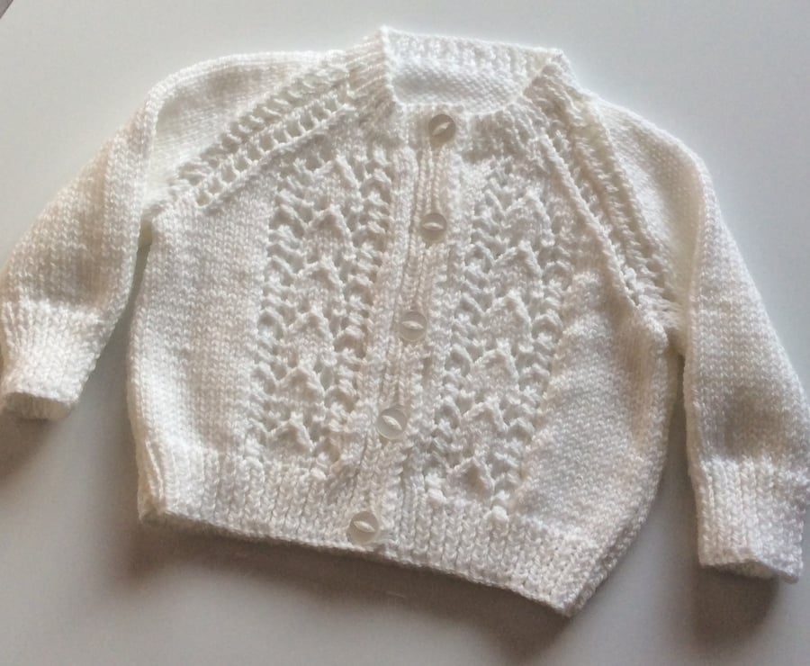 Hand knitted white baby cardigan