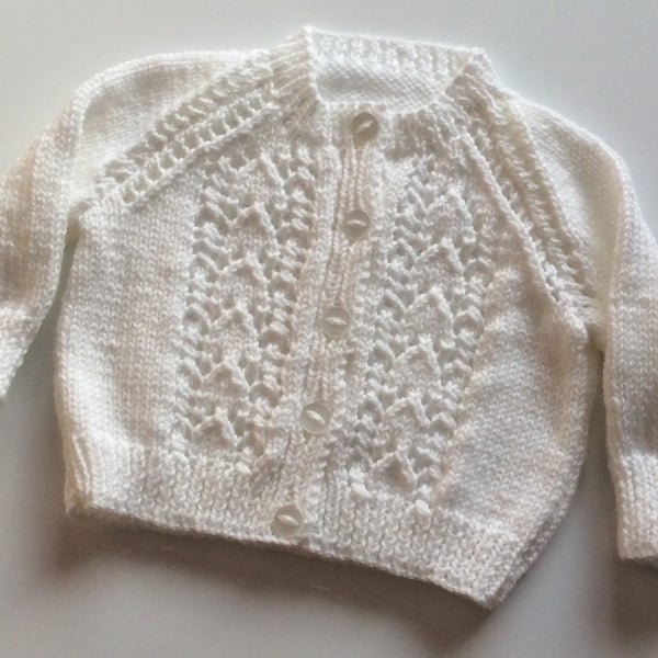 Hand knitted white baby cardigan