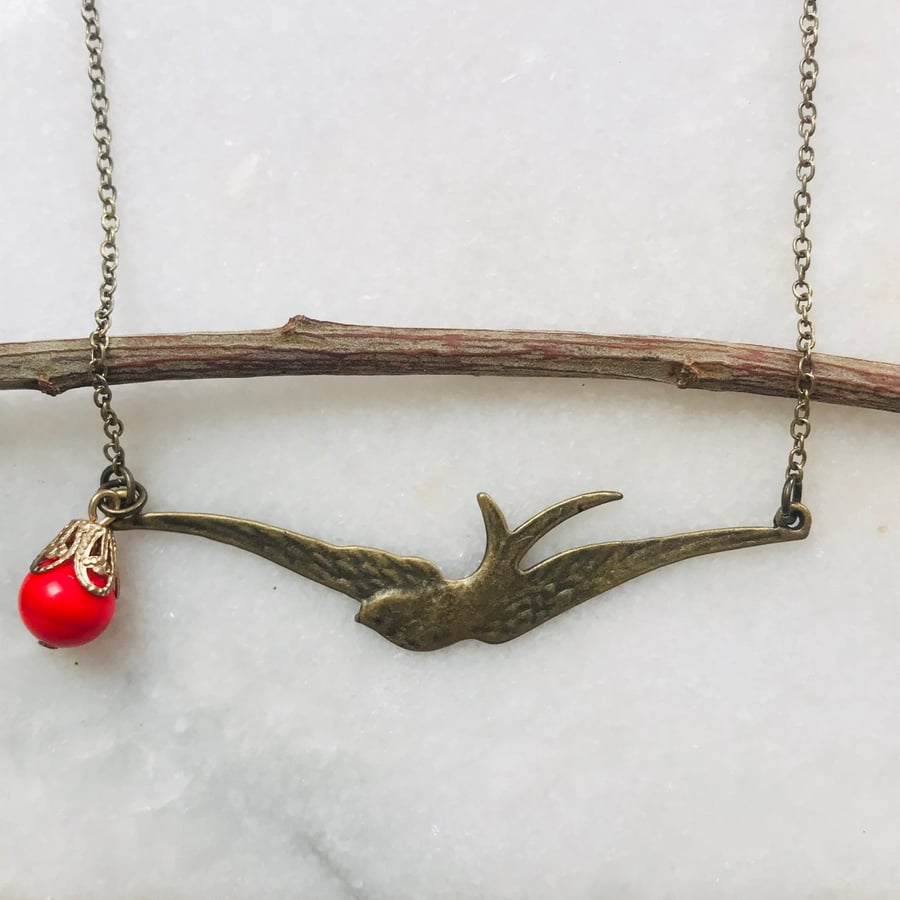 Pretty bird necklace with red vintage bead. 