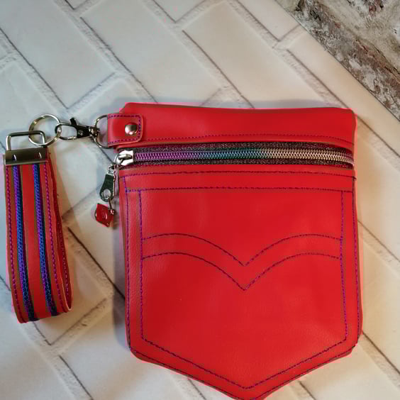 FULLY LINED JEANS POCKET STYLE RED VINYL BAG WITH MATCHING WRISTLET