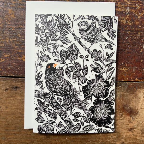 Hedgerow Birds in black with an orange pop on cream base. Based on an original l