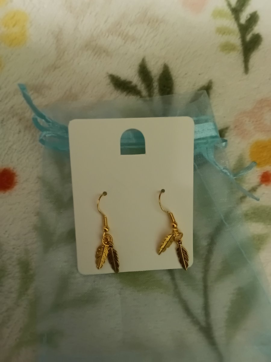 Gold plated cute little feather earrings,  very pretty