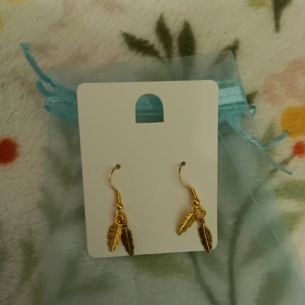 Gold plated cute little feather earrings,  very pretty