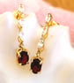 White Topaz And Red Garnet Gold Sterling Silver Drop Earrings - Image 1