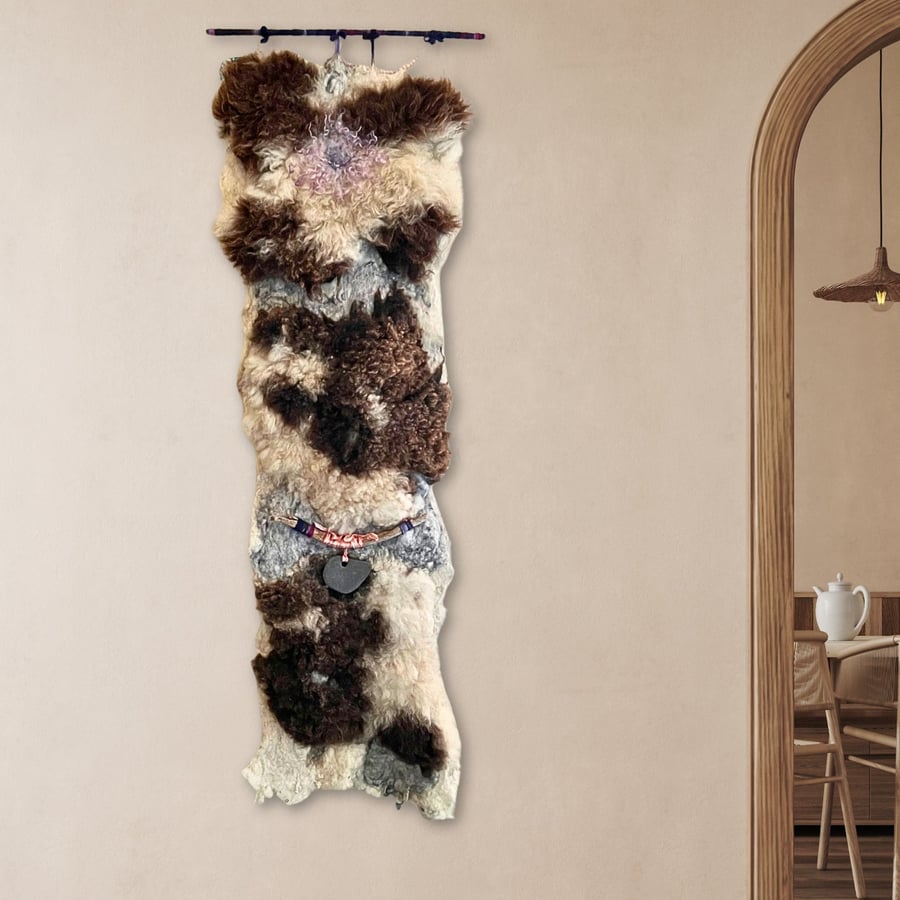 Art felt wall hanging with a large hagstone natural and tactile