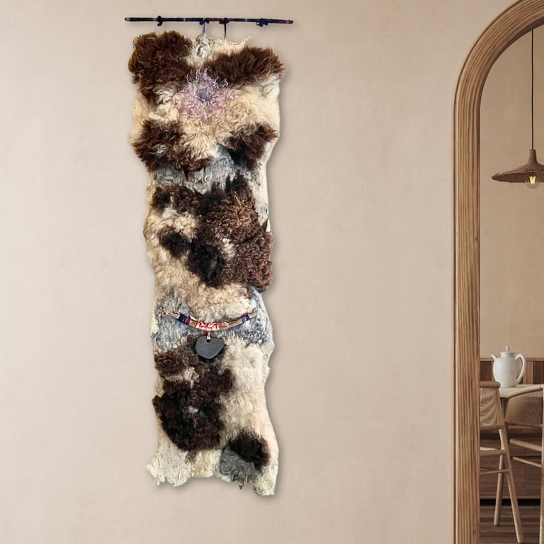 Art felt wall hanging with a large hagstone natural and tactile