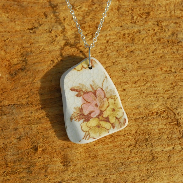 Beach pottery pendant with pink and yellow flowers