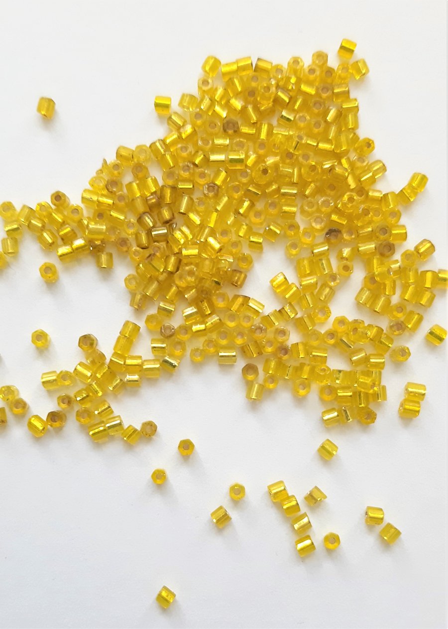 Metallic Yellow Hexagon beads, size 11.